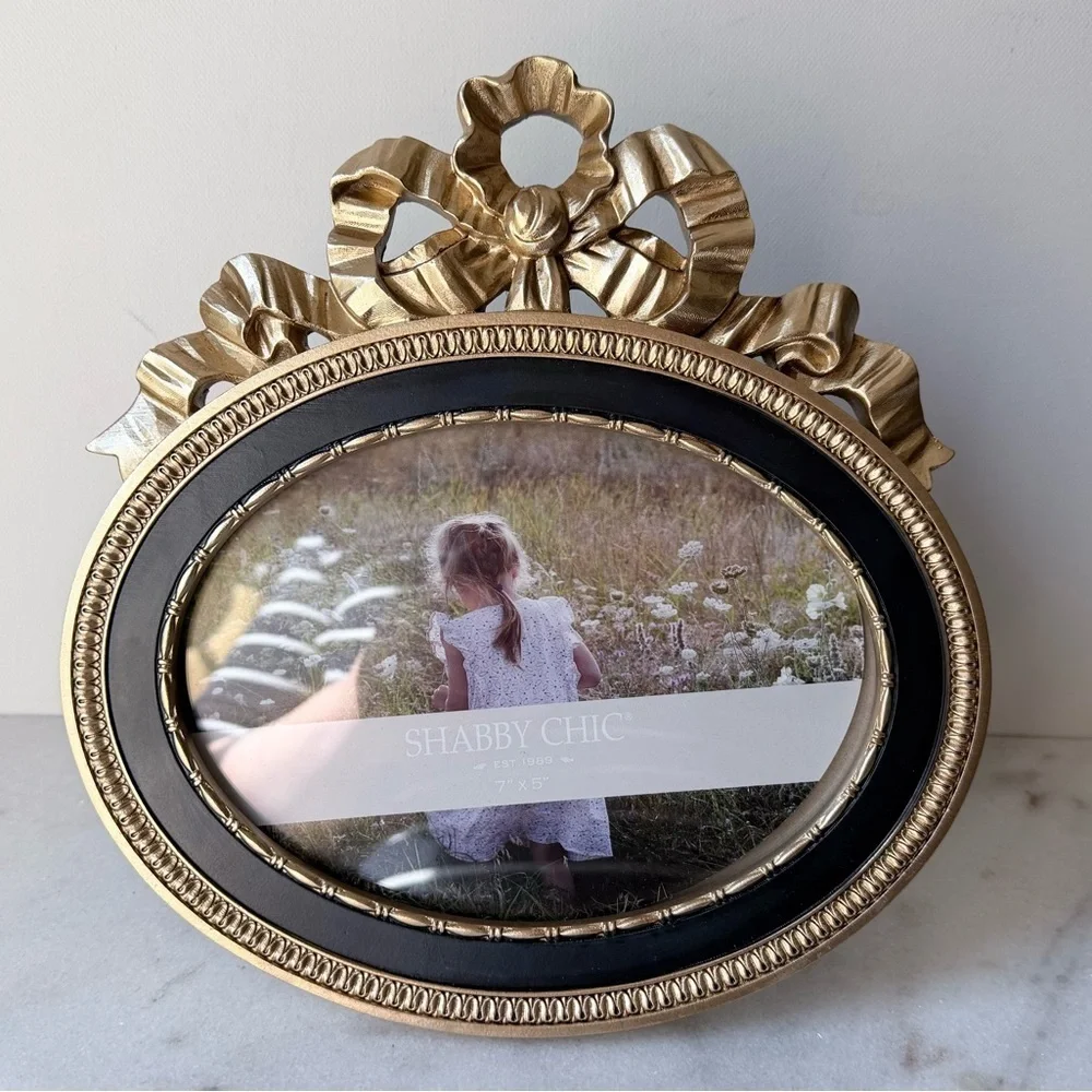 Ornate Oval Gold Photo Frame with Black Trim bow on top 7”x5”